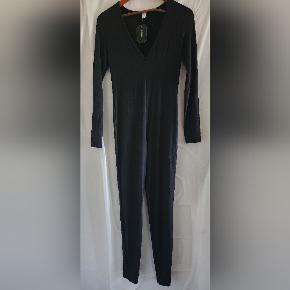 Sleek Black Jumpsuit with Long Sleeves and Modern Fit